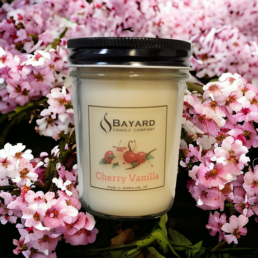 Cherry Vanilla Soy Candle sitting in cherry blossoms