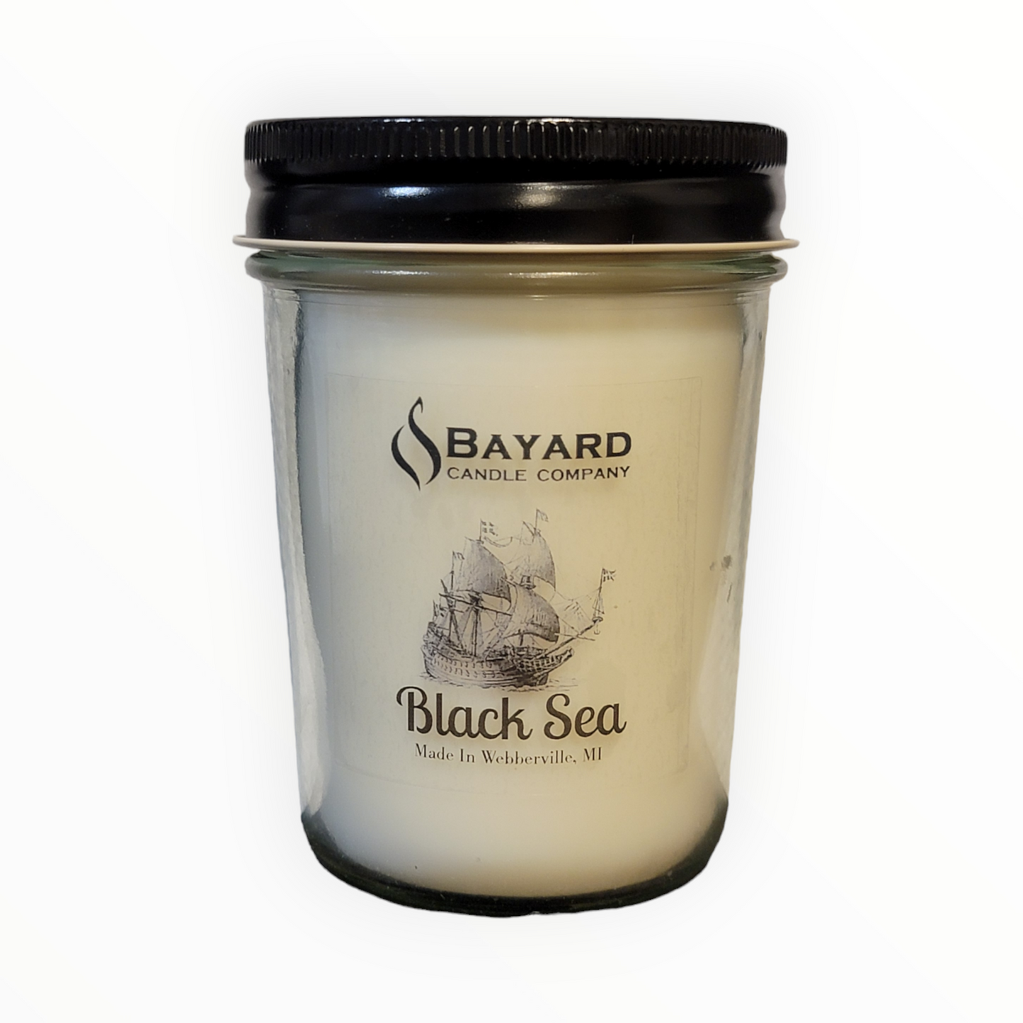 black sea soy candle on white background