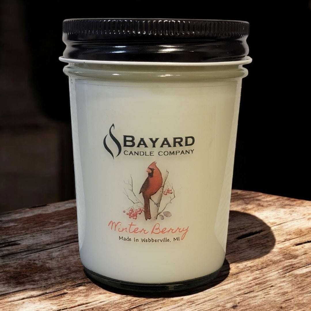 Winterberry soy candle on a wood table