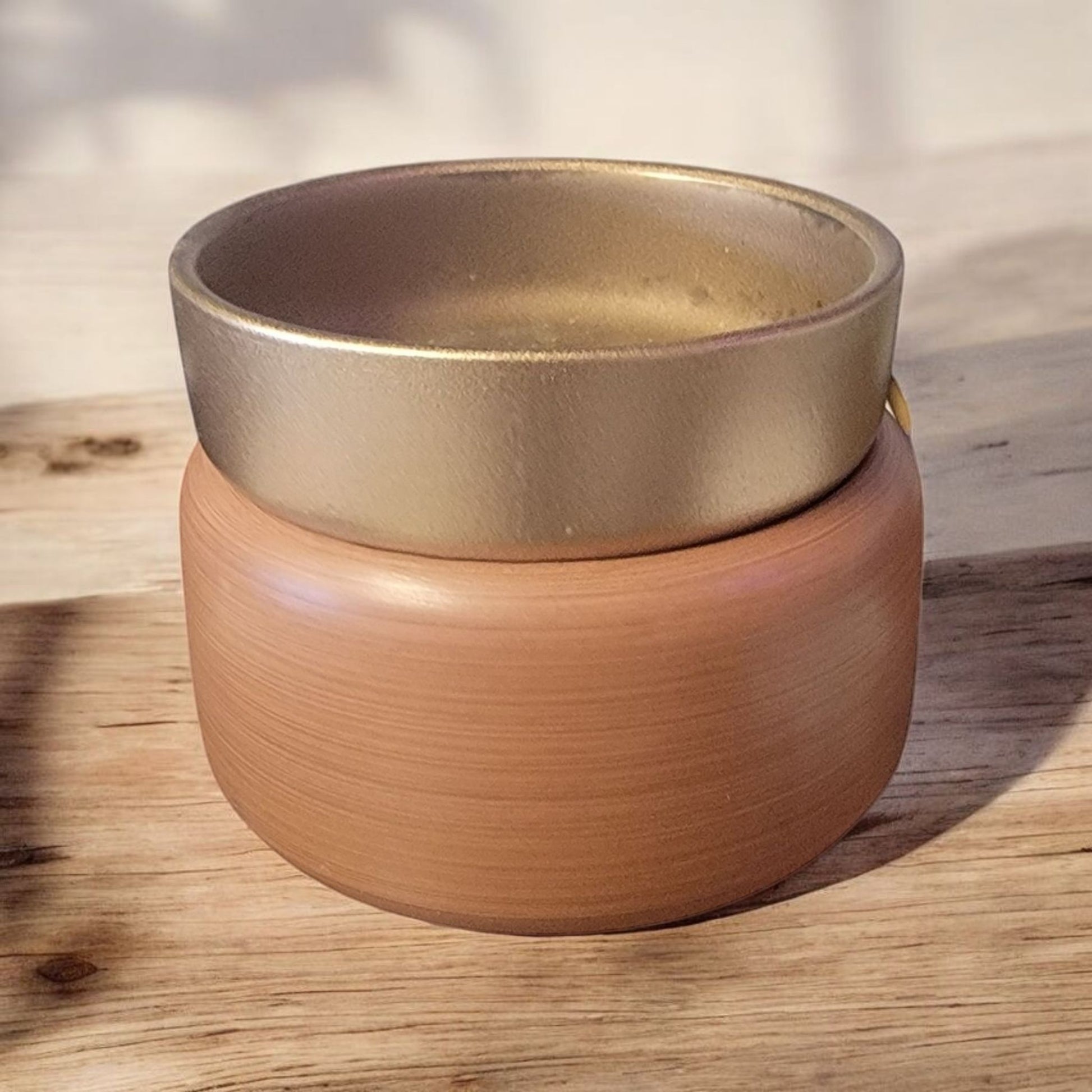 Pewter Walnut Wax Warmer on a wood table 