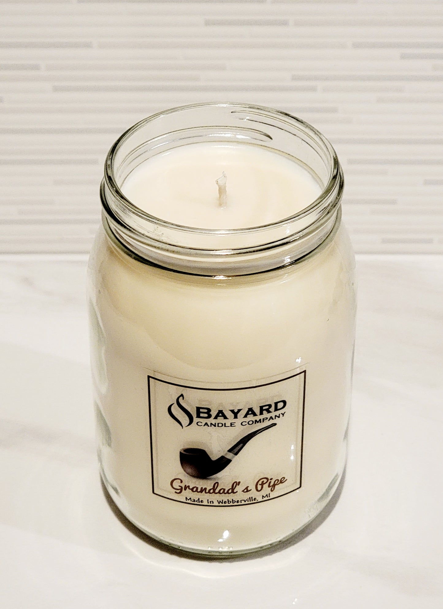 Grandads Pipe soy candle is made by Bayard Candle Company