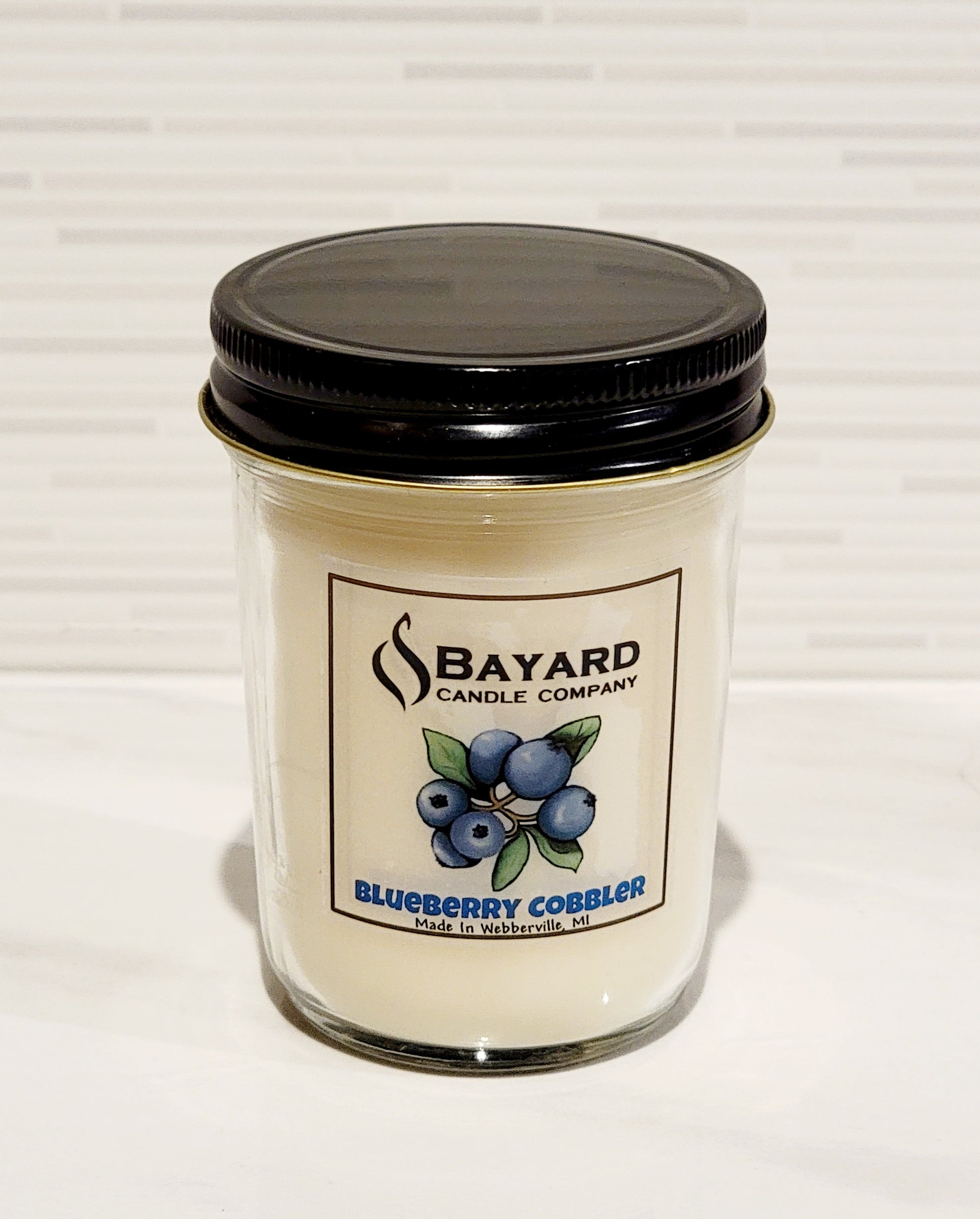 blueberry cobbler soy candle with top on