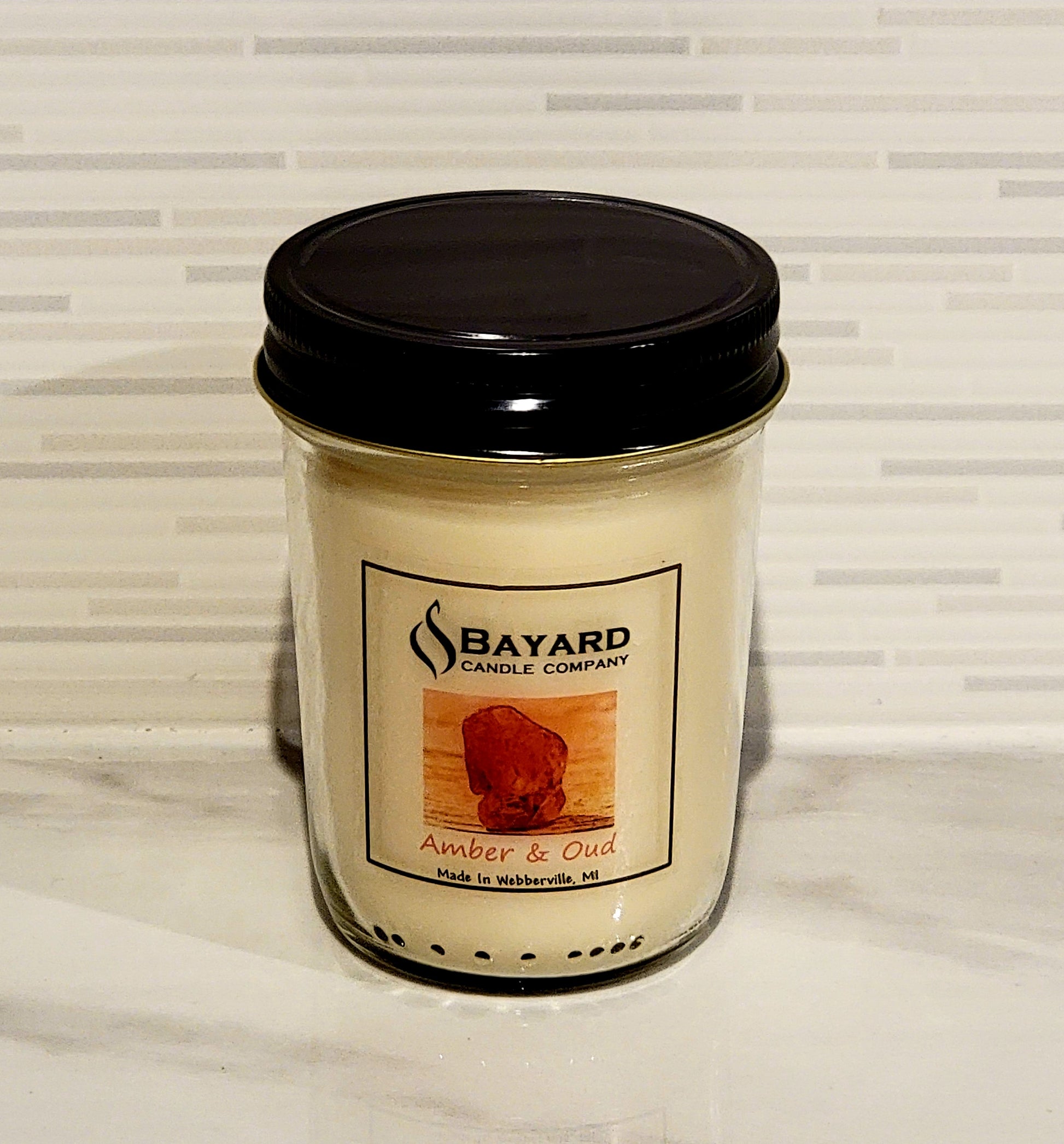 Amber and Oud soy wax candle made in Webberville, MI